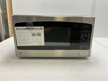 ÉGRATIGNURES - Micro-ondes GE 1200 W